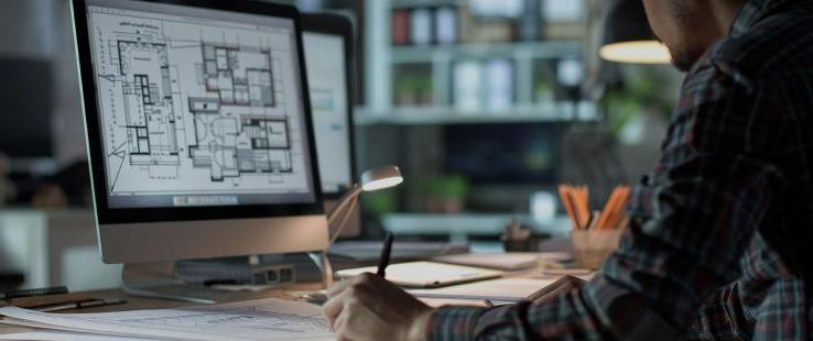 Architect working on a building layout on a computer